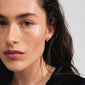 Close-up of a woman wearing AIAS crystal earrings gold-plated, featuring a nature-inspired design with sparkling Preciosa crystals, perfect for adding elegance to everyday style.