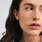 AIAS crystal earrings gold-plated on a woman's ear, showcasing their organic design with sparkling Preciosa crystals, embodying Pilgrim's Scandinavian craftsmanship and modern elegance.