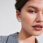 Close-up of a woman wearing LAVENDER earrings, silver-plated studs by Pilgrim, showcasing their organic design and handcrafted elegance.