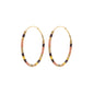 Gold-plated APPOLLONIA hoop earrings with tube-shaped glass beads, offering a relaxed summer style, perfect for layering and capturing the sun's rays.