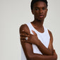 Silver-plated ANNEMETTE ring with a chunky heart design, worn by a man in a white tank top, showcasing a bold, romantic statement accessory.