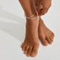 JELONA ankle chain silver-plated on foot, featuring layered Herringbone chains, ideal for adding a chic summer vibe to your style.