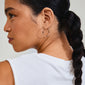 Close-up of a woman wearing silver-plated APPOLLONIA hoop earrings with glass beads, showcasing their elegant design and summer-ready style.