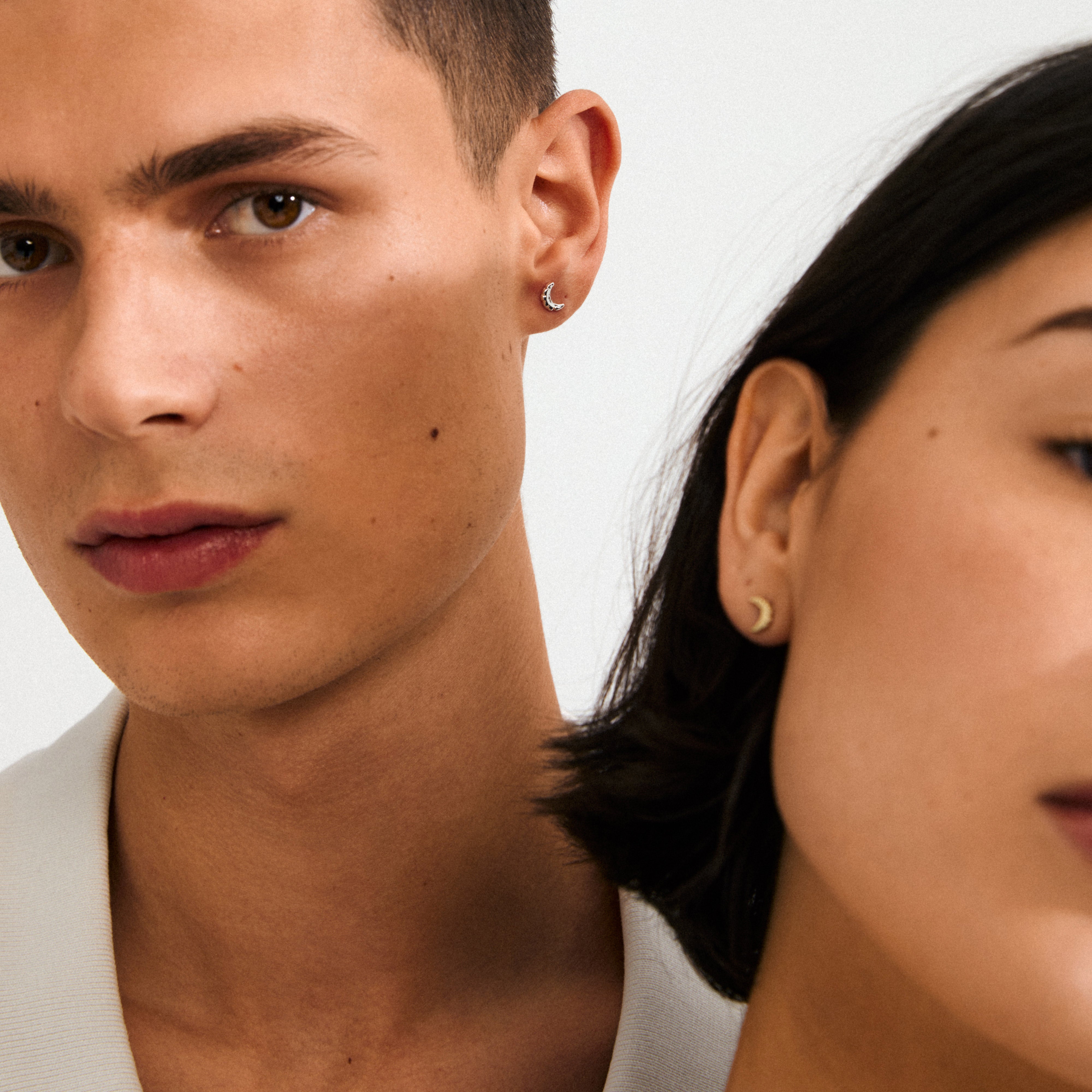 Gold-plated moon earrings by Pilgrim, showcasing rustic crescent design for a fairytale vibe, crafted from recycled materials, ideal for casual or elegant outfits.