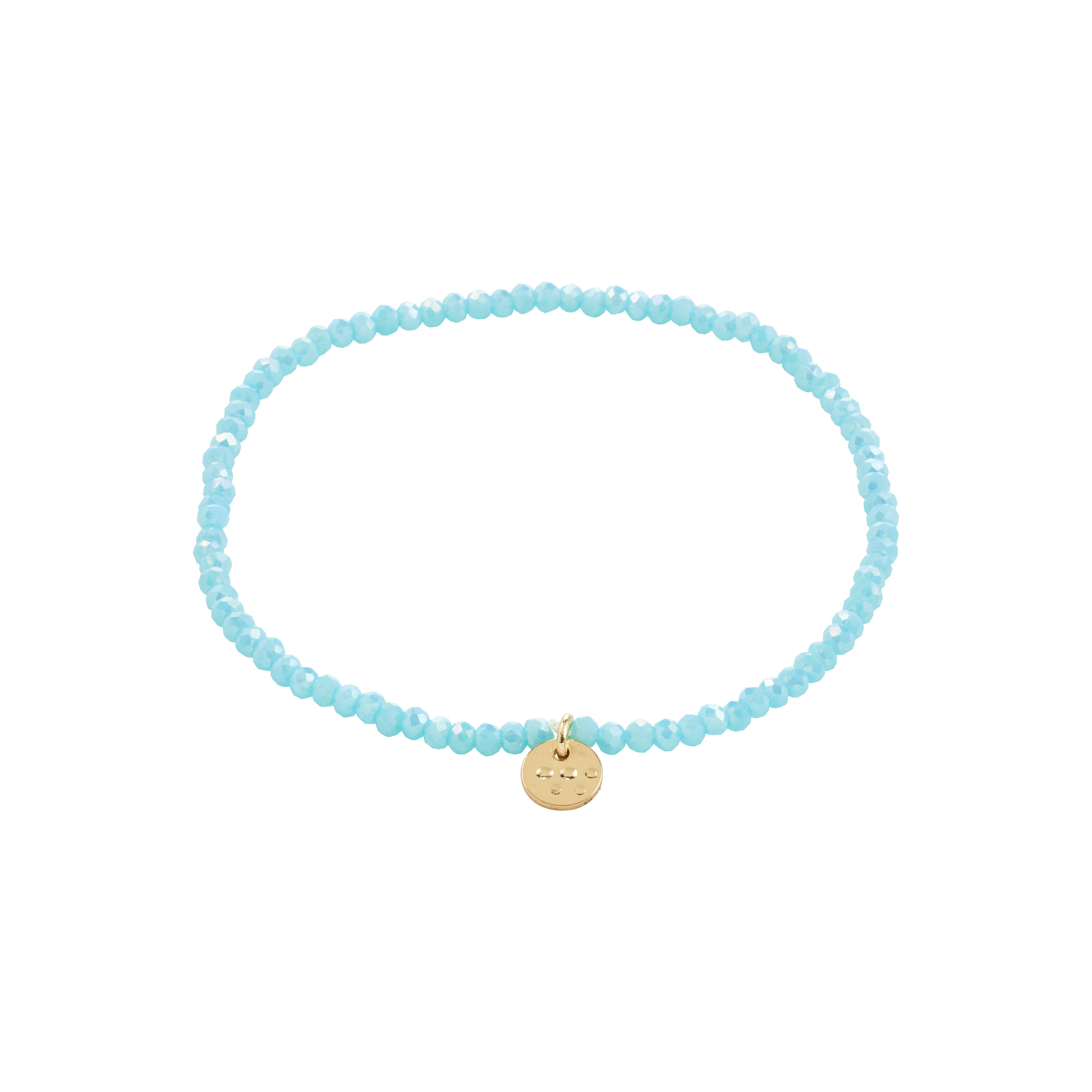 INDIE bracelet skyblue features faceted blue beads and a gold-plated disc, elegantly designed for stacking. Elastic fit, perfect for versatile styling.