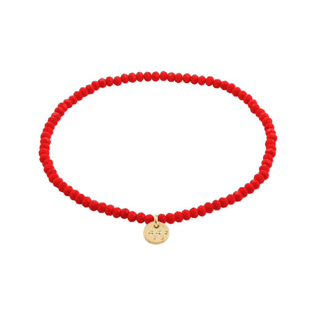 INDIE bracelet features red faceted beads and a gold-plated charm, showcasing Pilgrim's blend of timeless Danish design and trend-focused style.