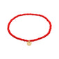 INDIE bracelet features red faceted beads and a gold-plated charm, showcasing Pilgrim's blend of timeless Danish design and trend-focused style.