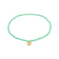 INDIE bracelet with mint-green faceted beads and a gold-tone disc charm, 17 cm stretch, from Pilgrim. Perfect for stacking and enhancing personal style.