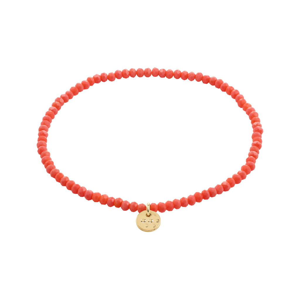 INDIE bracelet with peach faceted beads and a gold-plated charm, showcasing Pilgrim's Scandinavian craftsmanship, perfect for stacking and adding a stylish touch to any outfit.