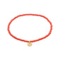 INDIE bracelet with peach faceted beads and a gold-plated charm, showcasing Pilgrim's Scandinavian craftsmanship, perfect for stacking and adding a stylish touch to any outfit.