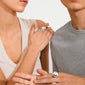 Two people wearing the JAMESON ring, a silver-plated, sculptural dome design, highlighting its chunky silhouette and adjustable fit, crafted from recycled materials.