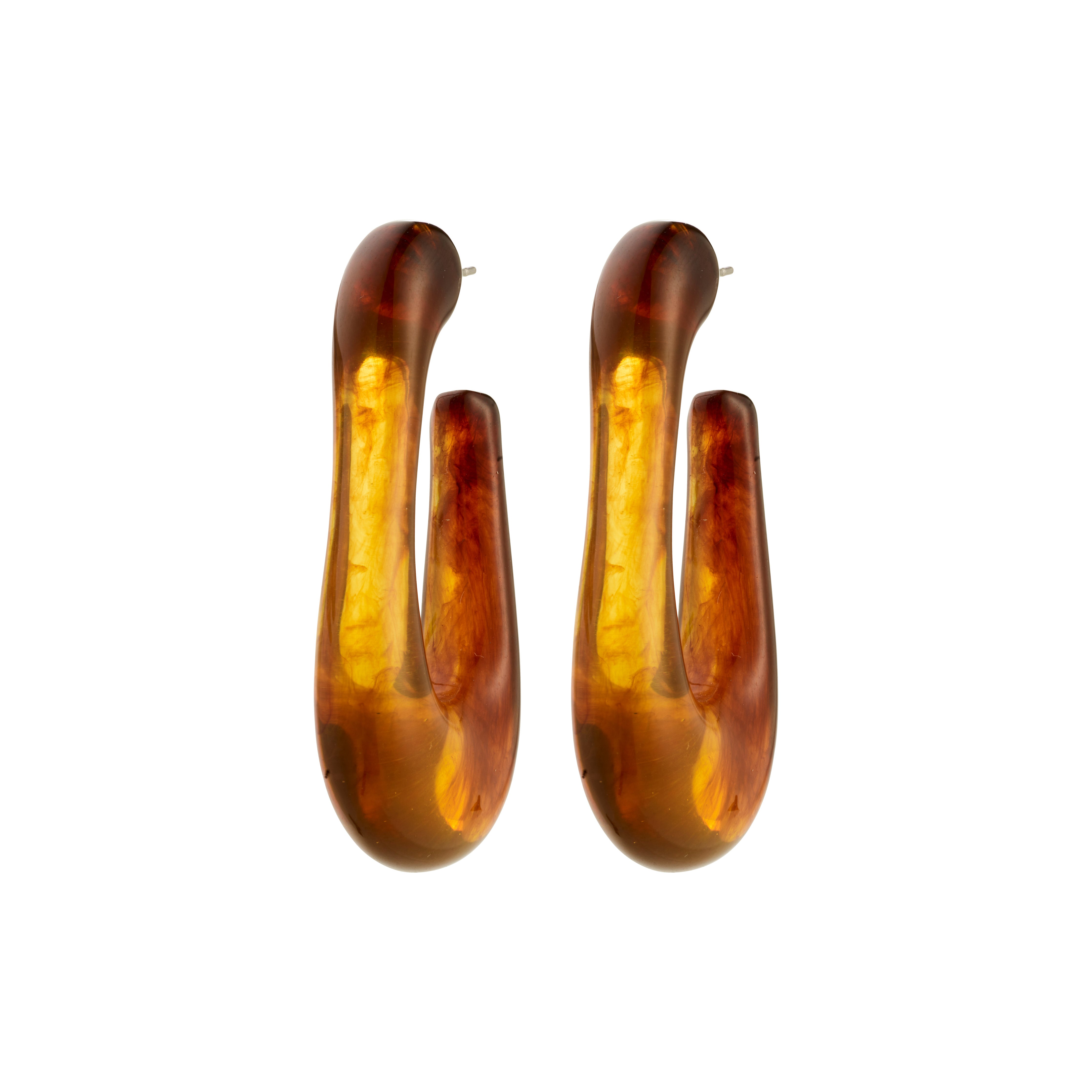 ELIJAH earrings brown from Pilgrim: elongated U-shaped design in translucent amber acrylic with gold swirls, offering a retro urban vibe with recycled materials.