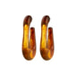 ELIJAH earrings brown from Pilgrim: elongated U-shaped design in translucent amber acrylic with gold swirls, offering a retro urban vibe with recycled materials.