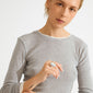 Person showcases the MADDIX ring, a silver-plated, chunky, wave-shaped design, highlighting its bold, artistic style; perfect for elevating minimalist looks.