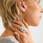 Side profile showing the MADDIX ring, a chunky, silver-plated heart-shaped statement piece by Pilgrim, resting on a neck, highlighting its bold, sculptural design.
