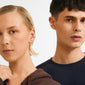 Two young adults wear HUDSYN ear cuffs, a 2-in-1 silver-plated set from Pilgrim, showcasing edgy and effortless style with multiple silver ear-cuff designs.