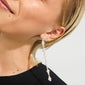 Close-up of a model wearing Pilgrim's BASIL earrings, silver-plated with linked segments and Preciosa crystals, showcasing a sophisticated, dynamic design.
