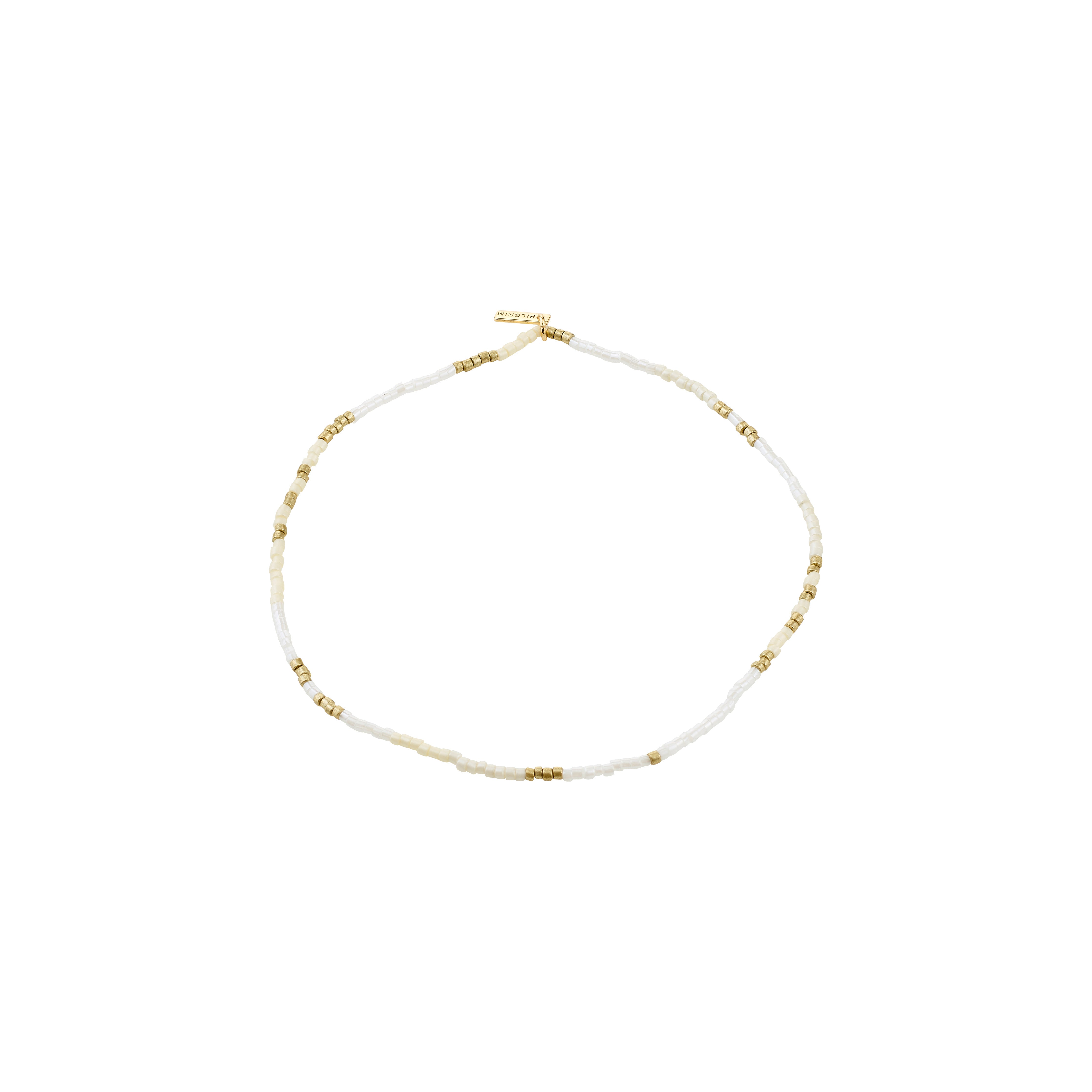 ALISON ankle chain in white and gold, featuring delicate seed beads and gold spacers, perfect for a boho summer look with comfortable lycra elastic.