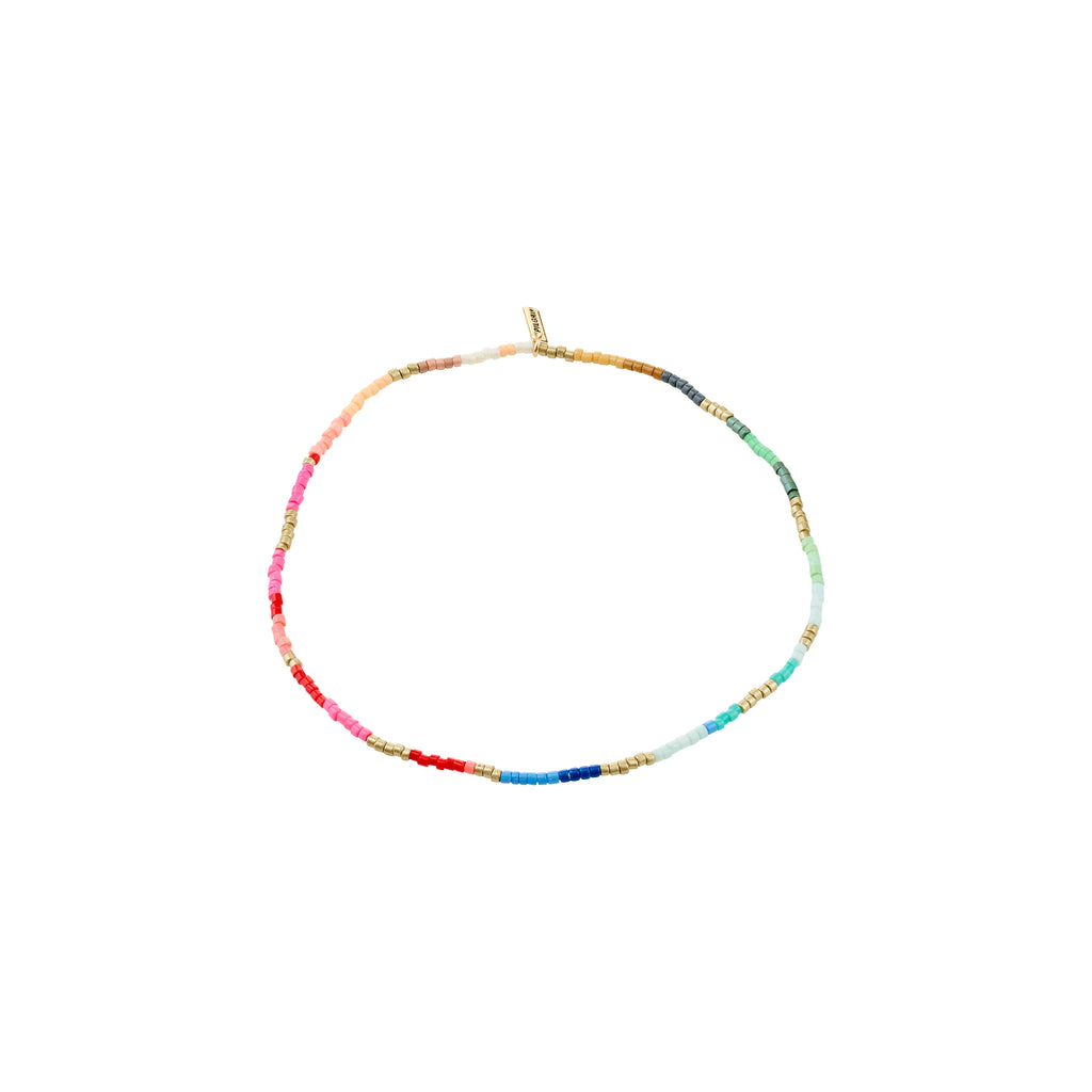 ALISON ankle chain, gold-plated, features rainbow-hued tube-shaped beads, perfect for a boho summer vibe. Slips on easily with soft lycra elastic for comfort.