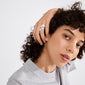 Young woman wearing Pilgrim's ALMA silver-plated rings, showcasing their sleek, adjustable design and minimalist style with 99% recycled materials.