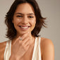 ASPEN crystal ring gold-plated on woman's finger, showcasing wide band with layered Preciosa crystals, embodying Pilgrim's stylish and sustainable Scandinavian craftsmanship.