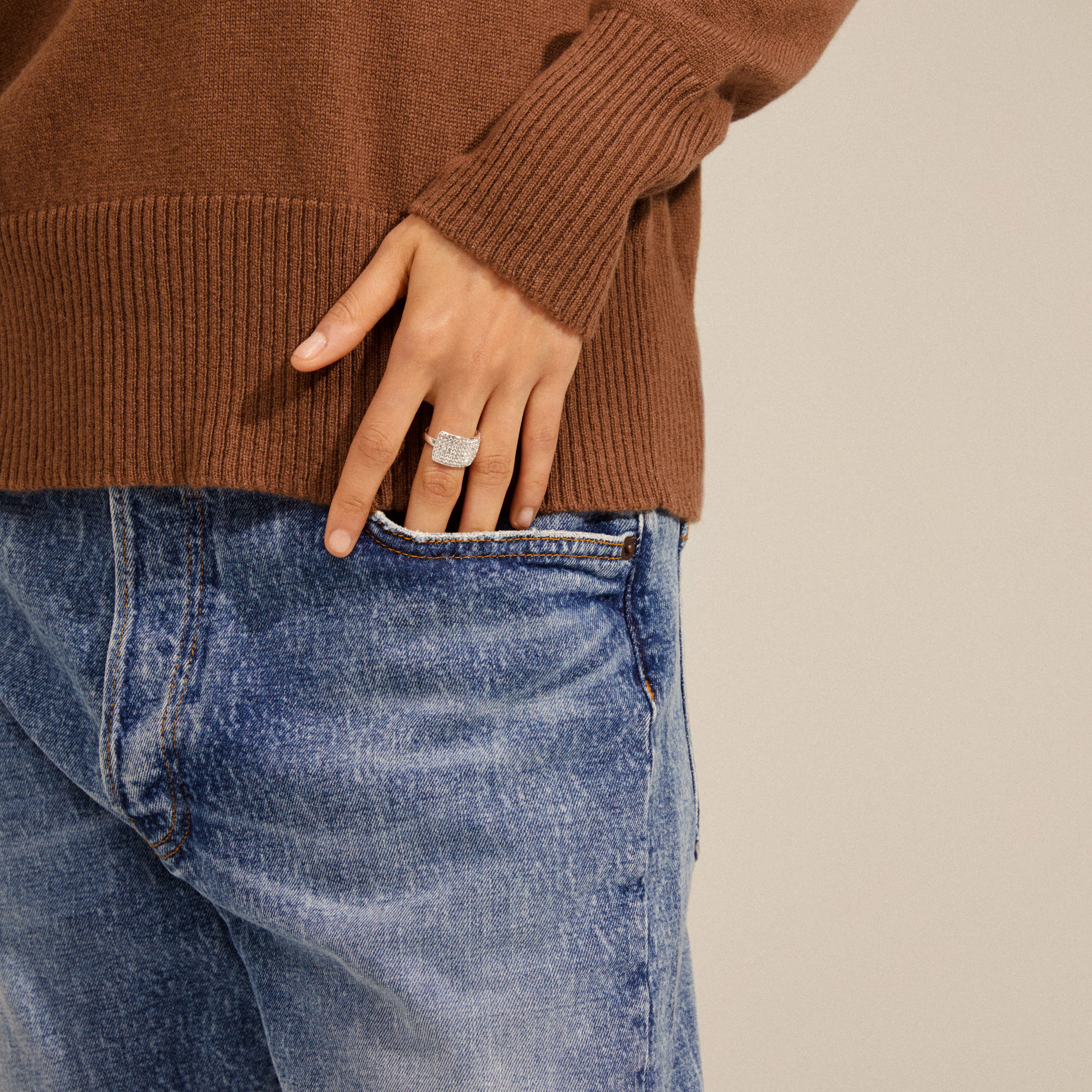 ASPEN crystal ring silver-plated on a hand in jeans pocket, featuring a wide band of layered Preciosa crystals for a sparkling, adjustable fit.