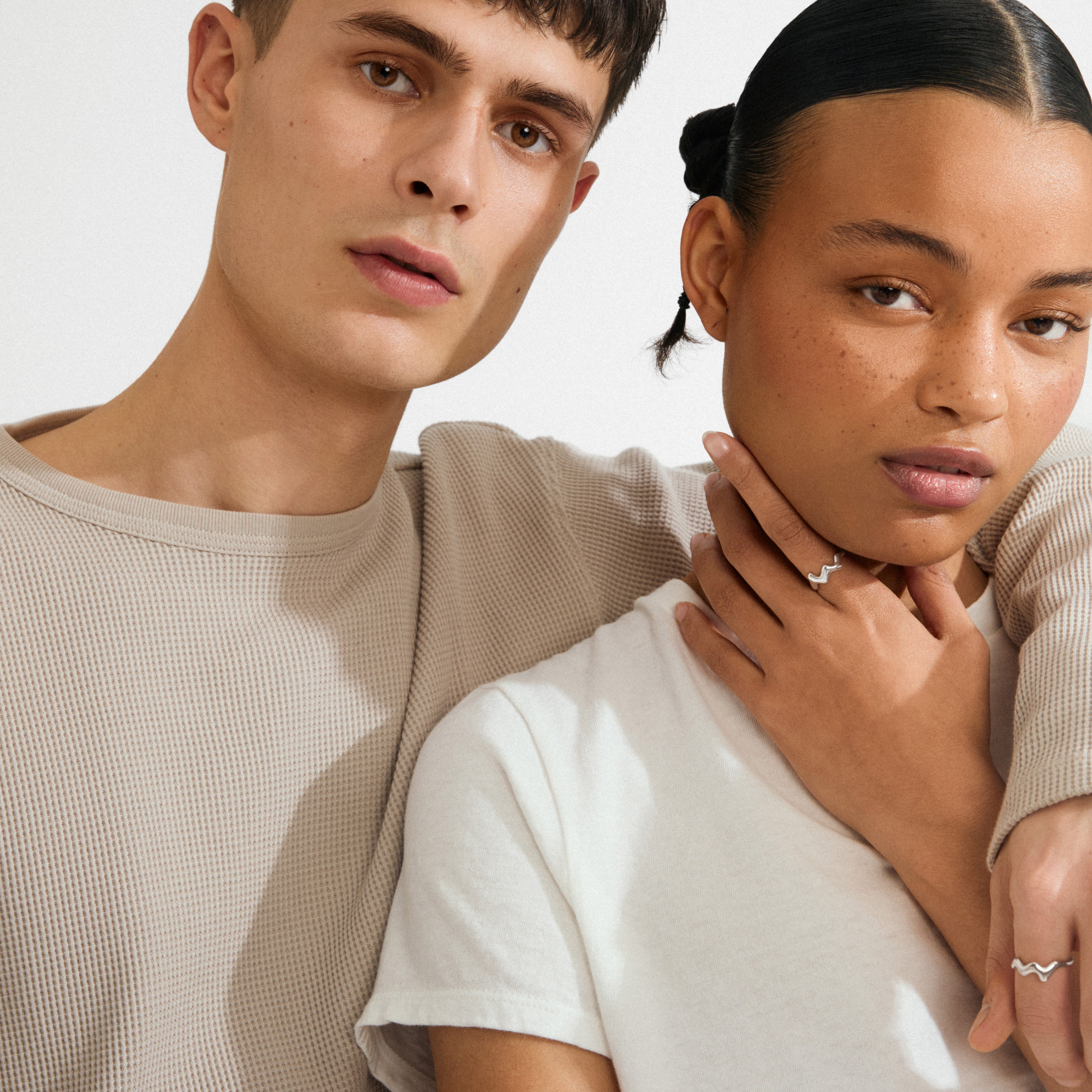 Young woman wears the LARKIN ring silver-plated, showcasing its wavy design. The ring complements her minimalist style, embodying Pilgrim's timeless and trendy Scandinavian craftsmanship.