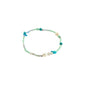 INDIANA bracelet mint featuring freshwater pearls, grey agate, and turquoise stones with faceted glass beads, creating an organic and stylish look.