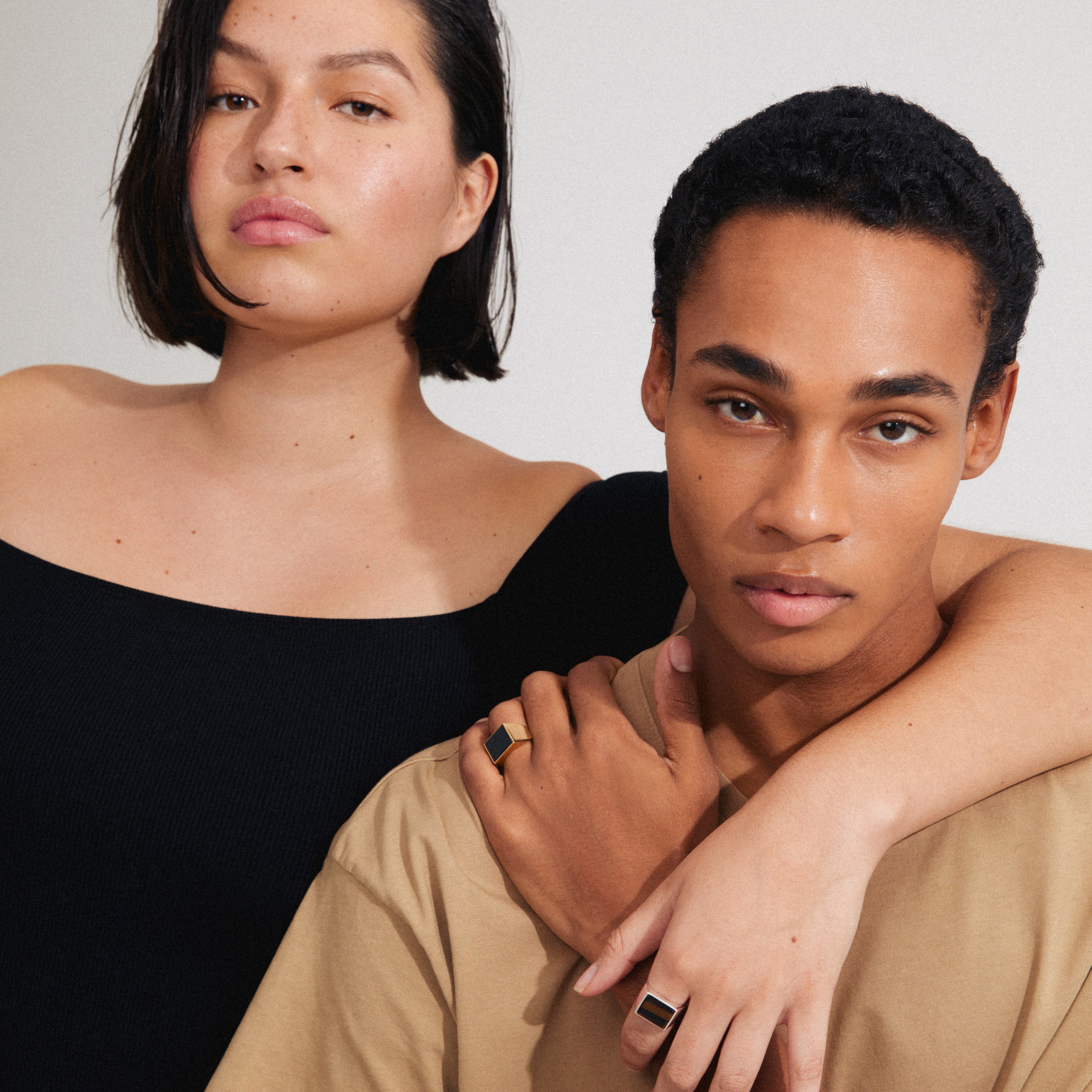 CASE signet ring gold-plated with a black Agate square, showcased on a woman's hand, exemplifying minimalist design and urban elegance.