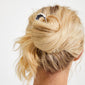 AMARIS hair accessory silver-plated secures a loose, messy bun with a sleek, minimalist design, embodying effortless elegance and sustainable style by Pilgrim.