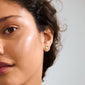 PORTER single earring gold-plated with organic disc shape, shiny finish, ideal for asymmetrical stacking. Crafted from 99% recycled materials, embodying Pilgrim's eco-friendly values.