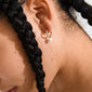 SEVYN single earring gold-plated: A gold-plated huggie hoop featuring Preciosa crystals and a bead pendant, offering elegance and sophistication. Eco-friendly, made from 75% recycled material.
