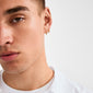 Young person wearing a ZOE single earring gold-plated with Preciosa crystals, showcasing a classic, versatile design suitable for mixing and matching styles.