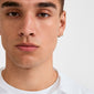Young man wearing the ZOE single earring gold-plated, featuring small Preciosa crystals and a click clasp, highlighting its classic and versatile design.