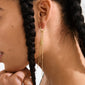 KARTER single earring gold-plated, featuring asymmetrical long chains, crafted from recycled material for an edgy, trendy look. Perfect for personalized, stylish layering.