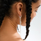 KARTER single earring, silver-plated, features asymmetrical long chains and a festive pendant, crafted from 99% recycled material for an edgy, personalized look.