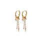 CHATERINE rose-colored twirl hoop earrings, gold-plated, featuring pink and pearl beads, exuding a breezy, feminine charm for any occasion.