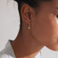 TITANIA single earring in gold-plated design, featuring a sun pendant with a Preciosa crystal, offering a luxurious boho touch with a click clasp.