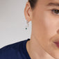 THERA single earring, silver-plated hoop featuring a moon pendant with a green stone, visible on a woman's ear. Lux boho vibes, crafted from recycled materials.