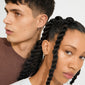 Two young adults showcase Pilgrim's LEAF 2-in-1 set huggie hoops gold-plated, both wearing small hoop earrings highlighting timeless style and sustainable craftsmanship.