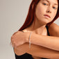 LEAF snake chain bracelet silver-plated, worn by a woman with red hair, features a T-bar clasp and is crafted from 75% recycled materials.