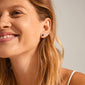 LEAF 2-in-1 set earrings silver-plated, featuring a smooth and shiny pair alongside a rustic, organic design, showcased on a woman smiling.