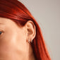 Woman wearing LEAF 2-in-1 silver-plated huggie hoops from Pilgrim, showcasing a close-up of the earrings on her ear.