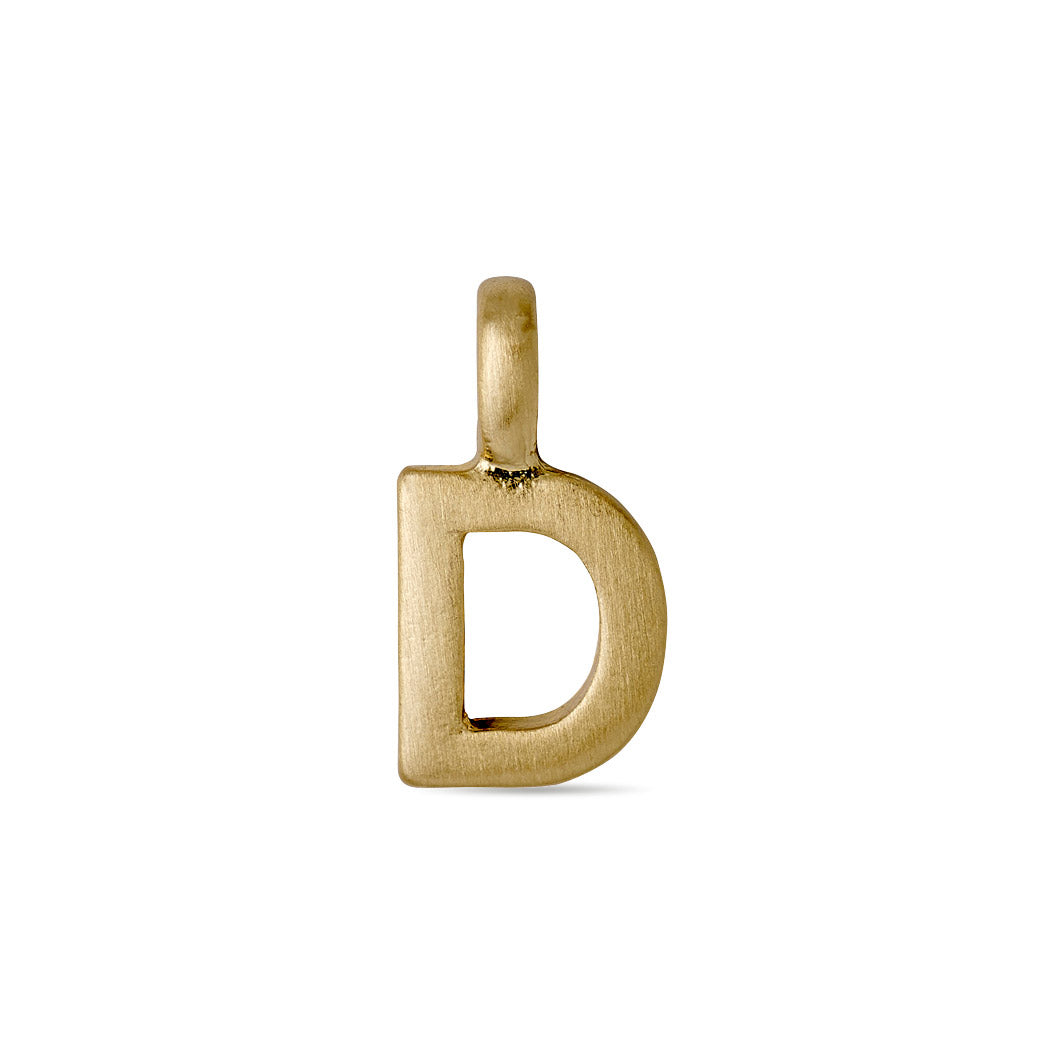 Gold-plated CHARM D pendant, perfect for personalizing necklaces or bracelets. A stylish, bespoke accessory for expressing individuality and personal connections.