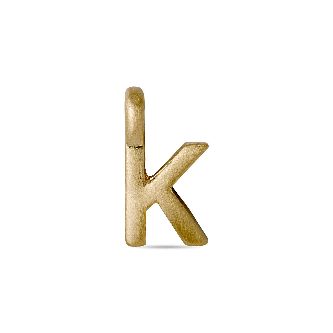 Gold-plated CHARM K pendant, ideal for personalizing accessories. Perfect for wearing solo or with other letters on a chain or bracelet.