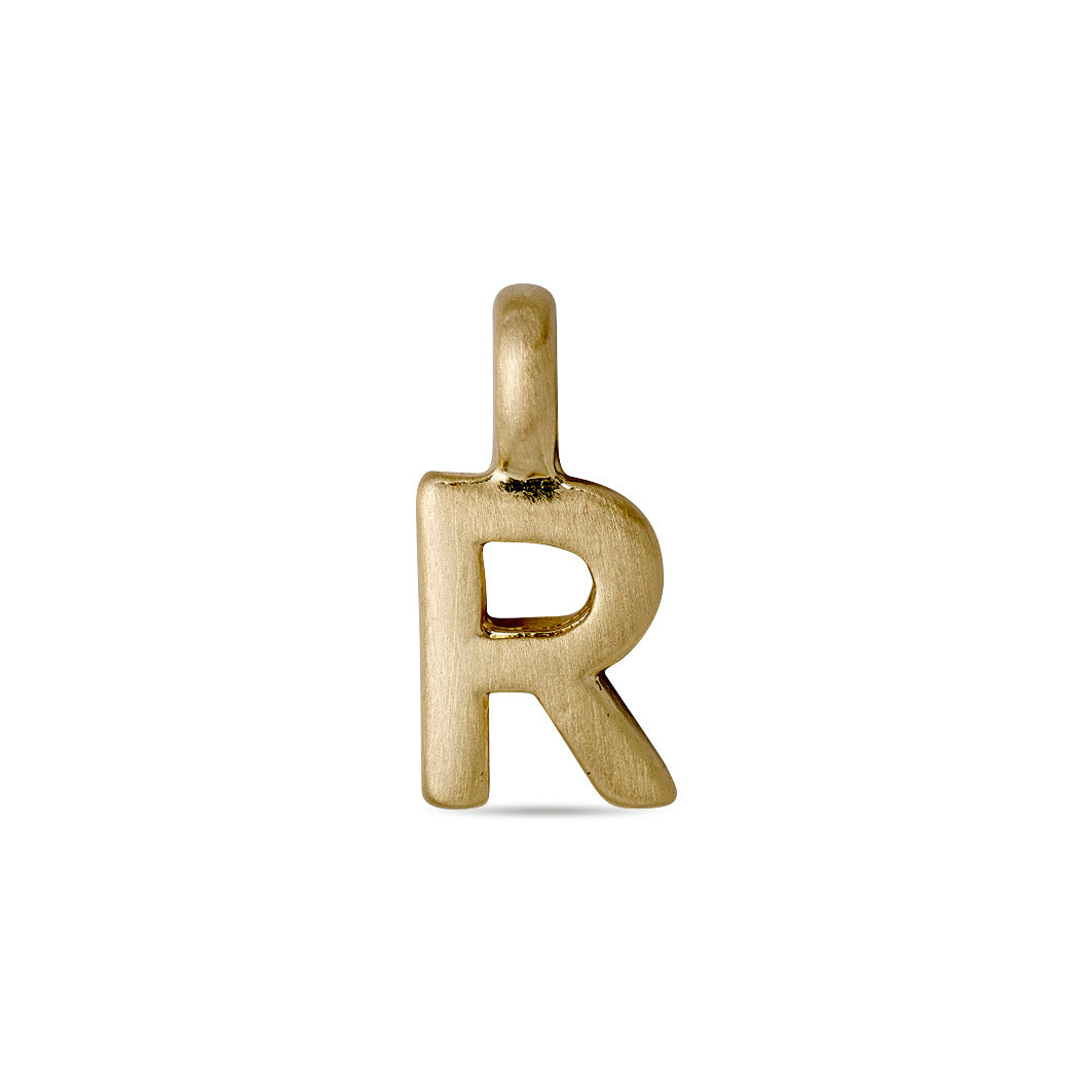 Gold-plated CHARM R pendant, perfect for personalization. Features a loop for necklaces or bracelets, adding a bespoke touch to your jewellery collection. Ideal for trendsetters.