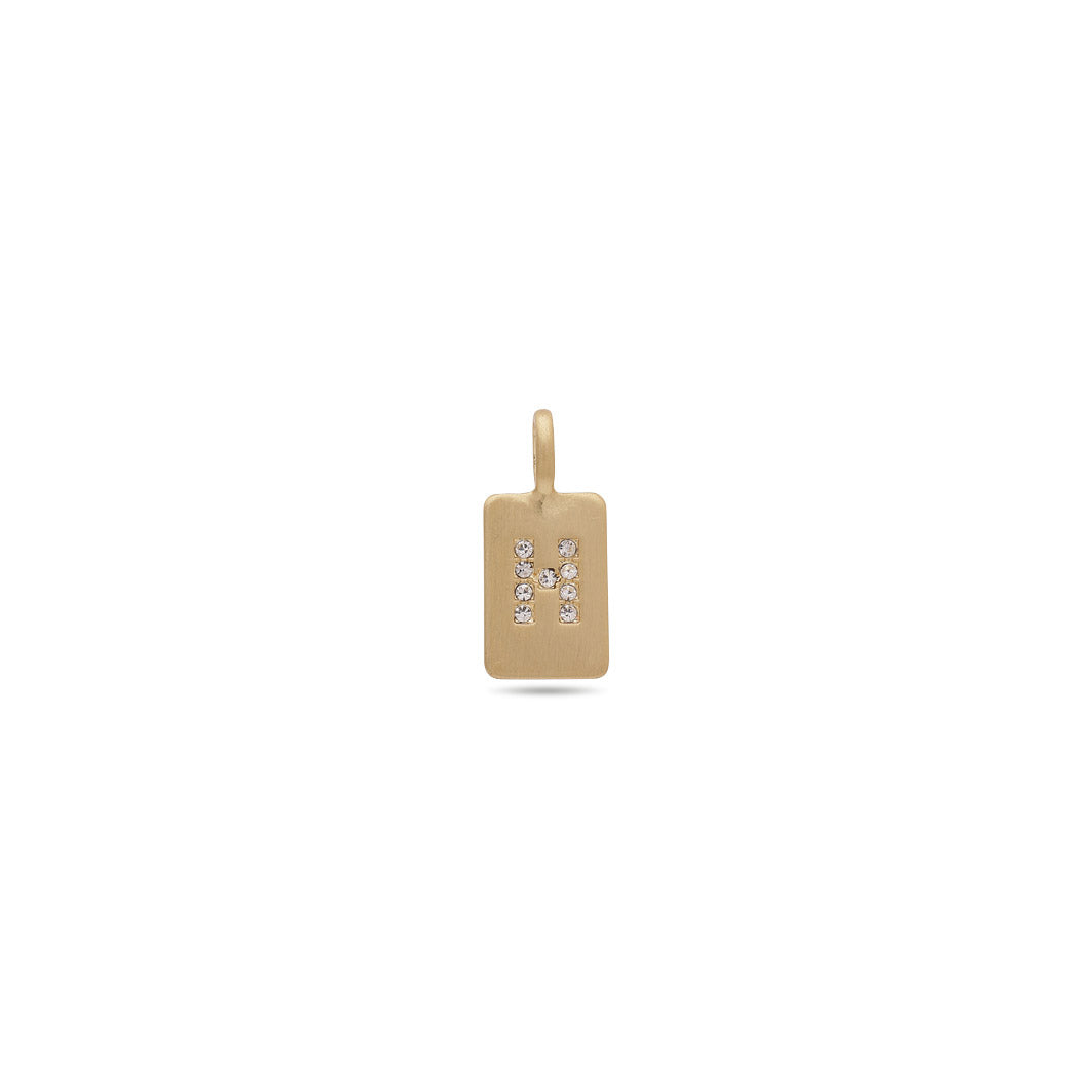 Gold-plated CHARM crystal H pendant with diamond accents, minimalist design symbolizing personal significance, perfect for bracelets or necklaces, embodying Pilgrim’s Scandinavian craftsmanship.