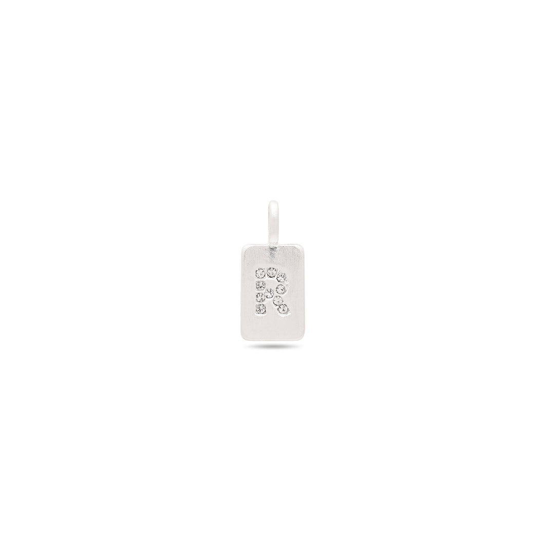 Silver-plated CHARM crystal R pendant with sparkling stones, featuring a satin matt surface, designed for versatile wear on bracelets and necklaces.