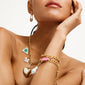 CHARM curb necklace gold-plated on a woman, featuring a bold curb chain design, ideal for adding personalized charms, embodying edgy urban style.