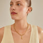 Woman wearing Pilgrim's CHARM stone pendant, gold-plated, showcasing Scandinavian craftsmanship with a rustic, personalized touch. Perfect for trendsetters seeking unique style.
